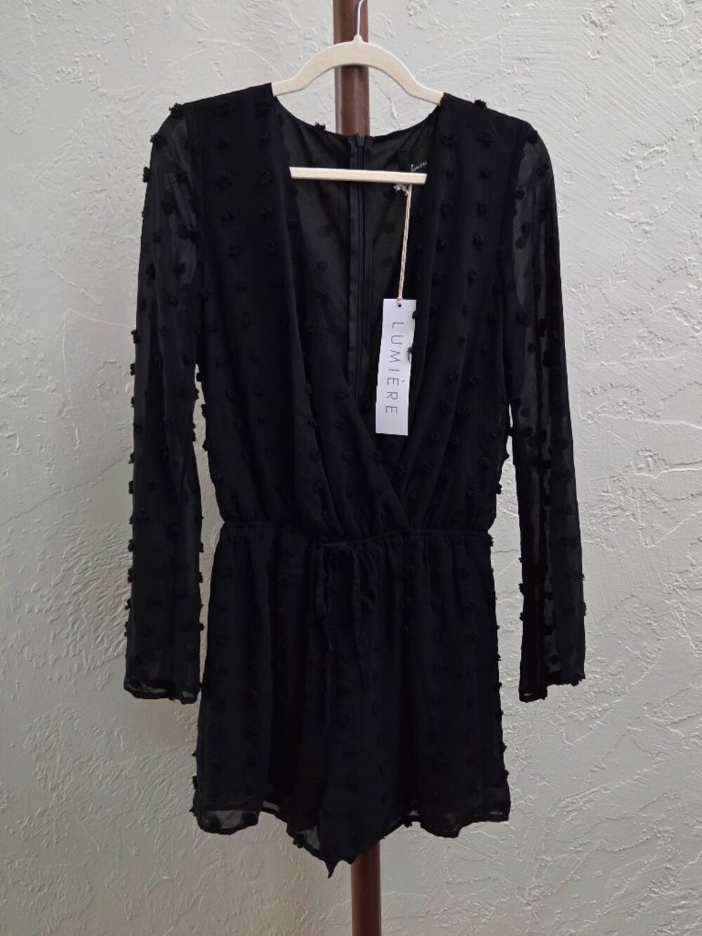 R63. Black Swiss Dot Long Sleeve Romper